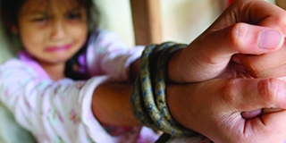 Asian human trafficking concept.Rope tied the hands of Thai girls.