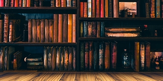 blurred Image many old books on bookshelf in library