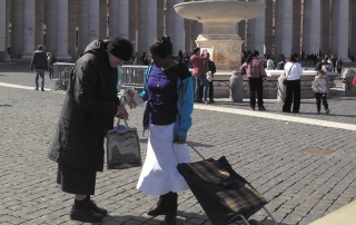 Miles Jesu distributes food to the poor in Rome