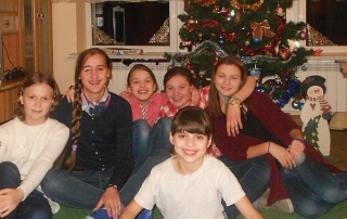 Ukraine girls in front of Christmas tree